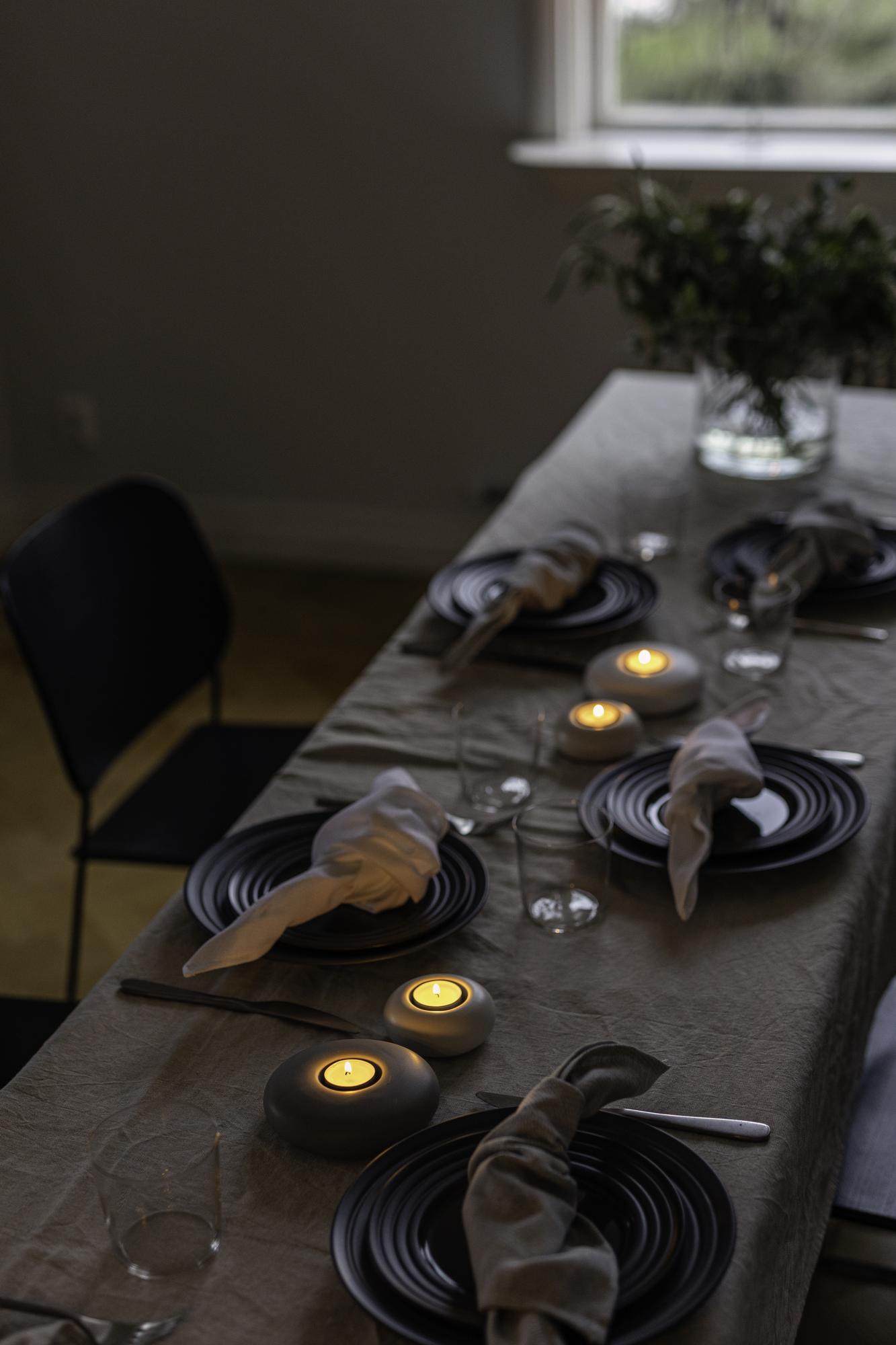 intimate tasting table set with linen and candles